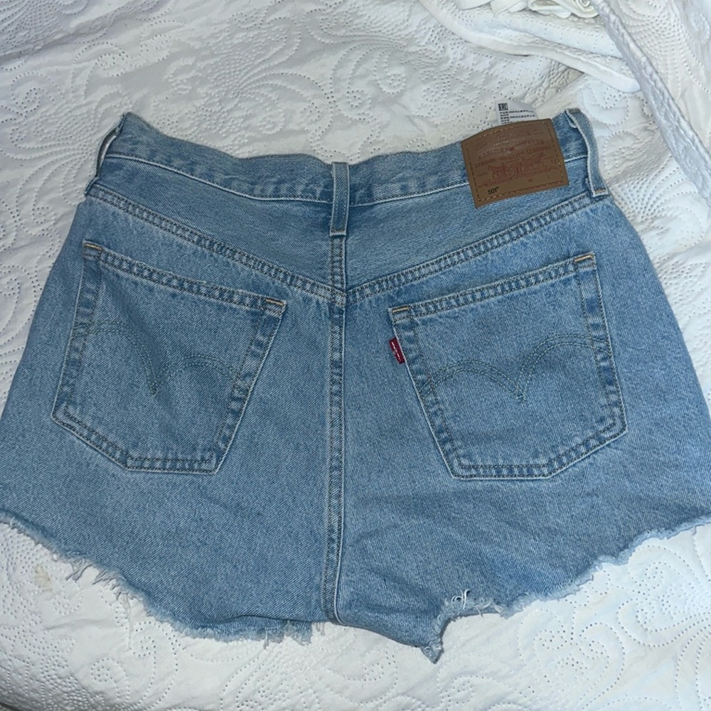 Levi’s ruffled blue jean shorts size 29.